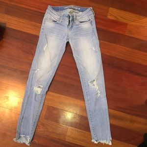 Light blue distressed jeans